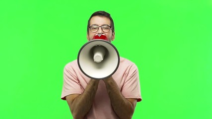man shouting through a megaphone  on green screen chroma key background - Powered by Adobe