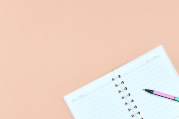 Notepad for text on a pastel color table with a copy. The concept of education and office.