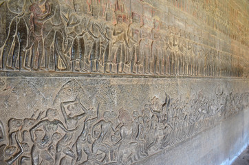Bas-relief sculpture showing scenes from the life of the Khmer, Angkor Wat, Cambodia.