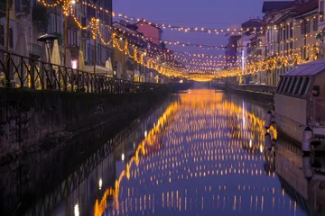 Foto op Plexiglas Night view of Naviglio Grande canal waterway in Milan, Italy. Christmas lights are reflected on the water. This district is famous for its restaurants, cafes, pubs and nightlife. © Arcansél