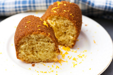 algerian homemade pound orange sliced cake on white plate