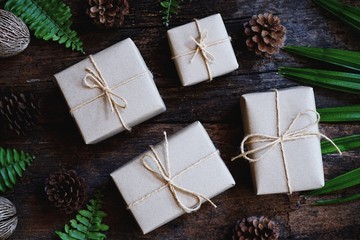 Eco friendly gift boxes wrapped with brown paper, green happy new year present concept