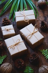 Eco friendly gift boxes wrapped with brown paper, green happy new year present concept
