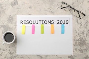 resolution 2019. text on paper with color stickers on a light background. top view