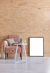 Modern room vertical style armchair coffee table and frame decoration.