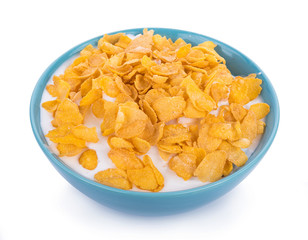 Corn flakes with milk in bowl isolated on white