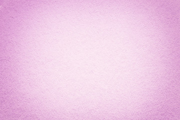 Texture of old light pink paper background, closeup. Structure of dense cardboard.