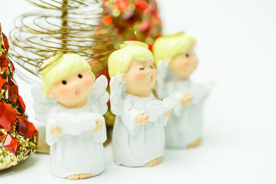 Christmas caroling or Carolers singing.Angel group singing carol song on celebration of christmas day in winter time white background.copy space.