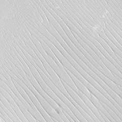 Silver watercolor texture with abstract washes and brush strokes on white paper background. Trendy look. Chaotic abstract organic design.