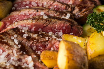 Slice rare roast beef with rock salt