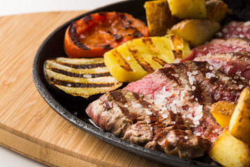 Succulent portion rare sliced roasted beef steak