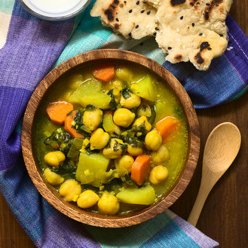 Vegan Chickpea Curry Or Chana Masala With Spinach, Potato And Carrot, Served With Naan Bread, Photographed Overhead With Natural Light