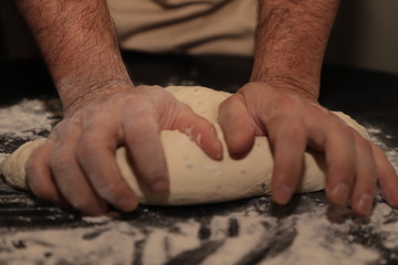 Kneading bread dough by hands