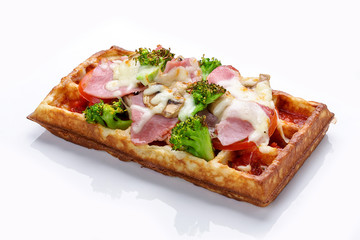 Belgian waffle on a white background. Stuffed with ham cheese and broccoli