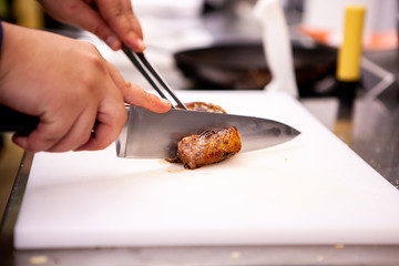 Chef slicing perfect cooked duck breast. Delicious perfect meat