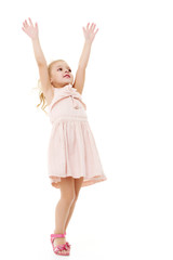 Little girl in a dress developing in the wind.