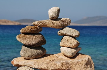 A tower of stones on Ftenagia beach at Emborio on the Greek island of Halki.
