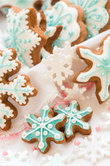 Christmas decoration with cookies in the shape of snowflakes and stars on a white background. Top view.