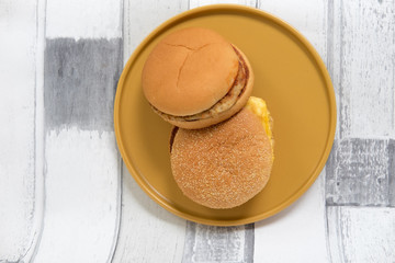 Tasty fresh pork burgers and egg muffin