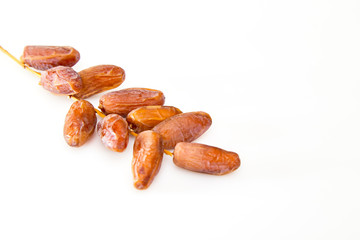 Date fruits over white background