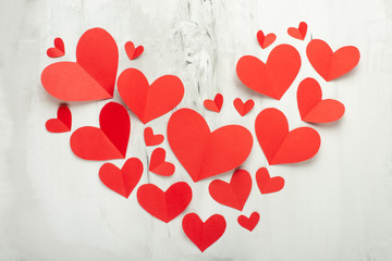 Texture and background for Valentine's Day, Heart of red hearts on a white background