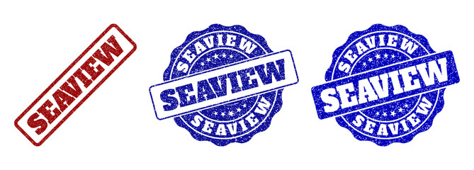 SEAVIEW grunge stamp seals in red and blue colors. Vector SEAVIEW labels with grunge surface. Graphic elements are rounded rectangles, rosettes, circles and text labels.