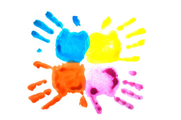 Four colorful child's handprints isolated on white. World autism awareness day concept.