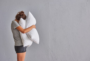 Girl rug the pillow sleep concept.