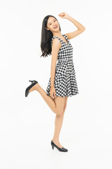  portrait of excited surprised attractive  inspired girl jumping up isolated on background.Freedom legs stylish feet glamorous people teenager asian.