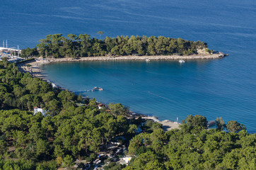 Fototapeta na wymiar View of the sea Bay from the mountain, the shore and the protruding Peninsula with trees