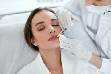 Obraz na płótnie Canvas Lip Augmentation. Woman Getting Beauty Injection For Lips