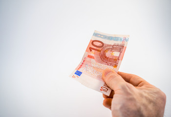 €10 Ten Euro banknote being offered by hand