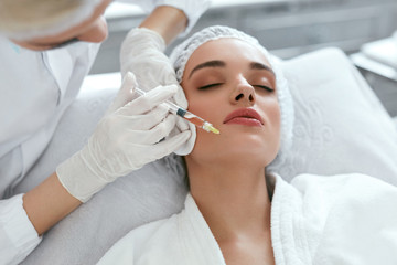 Beauty Injections. Woman Getting Face Lifting Procedure Closeup