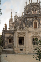 Obraz premium SINTRA, PORTUGAL - NOVEMBER 19, 2018: Quinta da Regaleira is an estate located near the historic center of Sintra, Portugal. It is classified as a World Heritage Site by UNESCO