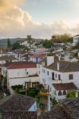 OBIDOS, PORTUGAL - NOVEMBER 20, 2018: View of Obidos at sunset, its streets, squares, walls and its castle are a popular tourist destination