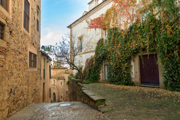 CACERES, SPAIN - NOVEMBER 25, 2018: typical medieval narrow street of the historic center of the...