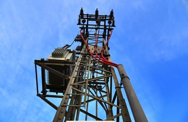 Electric antenna and communication transmitter tower in a german landscape