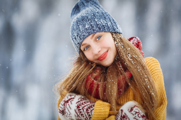 Winter young woman portrait. Beauty Joyful Model Girl laughing and having fun in winter park. Beautiful young female outdoors, Enjoying nature, wintertime