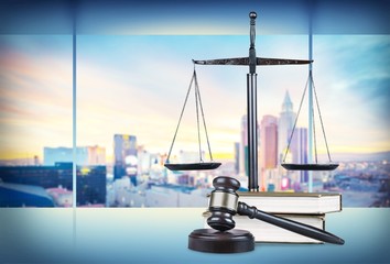 Justice Scales and books and wooden gavel on table. Justice