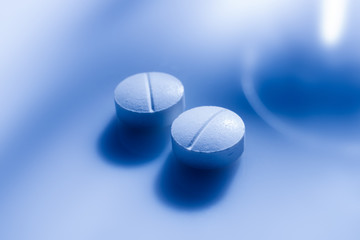 Close up of a couple of medicine pills