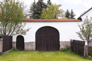 Fototapeta na wymiar Large door from repaired historic building, Symbol of village life