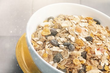 Bowl of  tasty corn flakes  on background