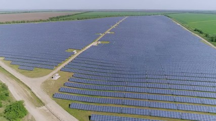 Aerial shot of triangular solar electricity station in Odessa region in summer