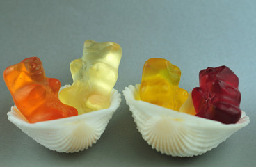 gummy bears sitting in cockle shells
