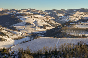 Scenic view of a snow covered hills landscape in winter, Langhe, Piedmont, Itlay