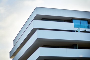 Modern apartment buildings on a sunny day with a blue sky. Facade of a modern apartment building