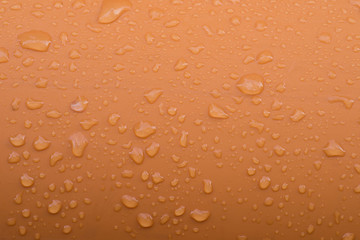 water drops on plastic orange tube macro