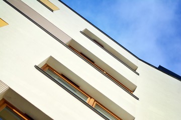 Modern apartment buildings on a sunny day with a blue sky. Facade of a modern apartment building