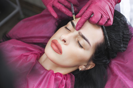 Close up still of collagen injection. Cosmetological prosedure of botox injection. Woman in the beauty salon makin anti-agieing procedures.