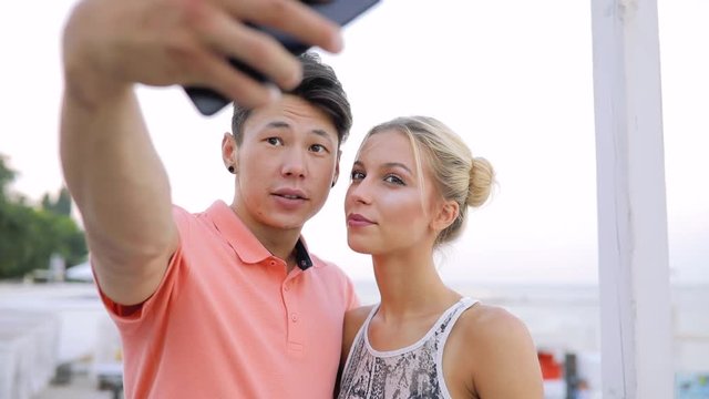 Young couple make selfie photos when they together